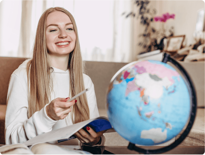 ZoniLive girl holding a globe, symbolizing global education and cross-cultural learning through online platforms